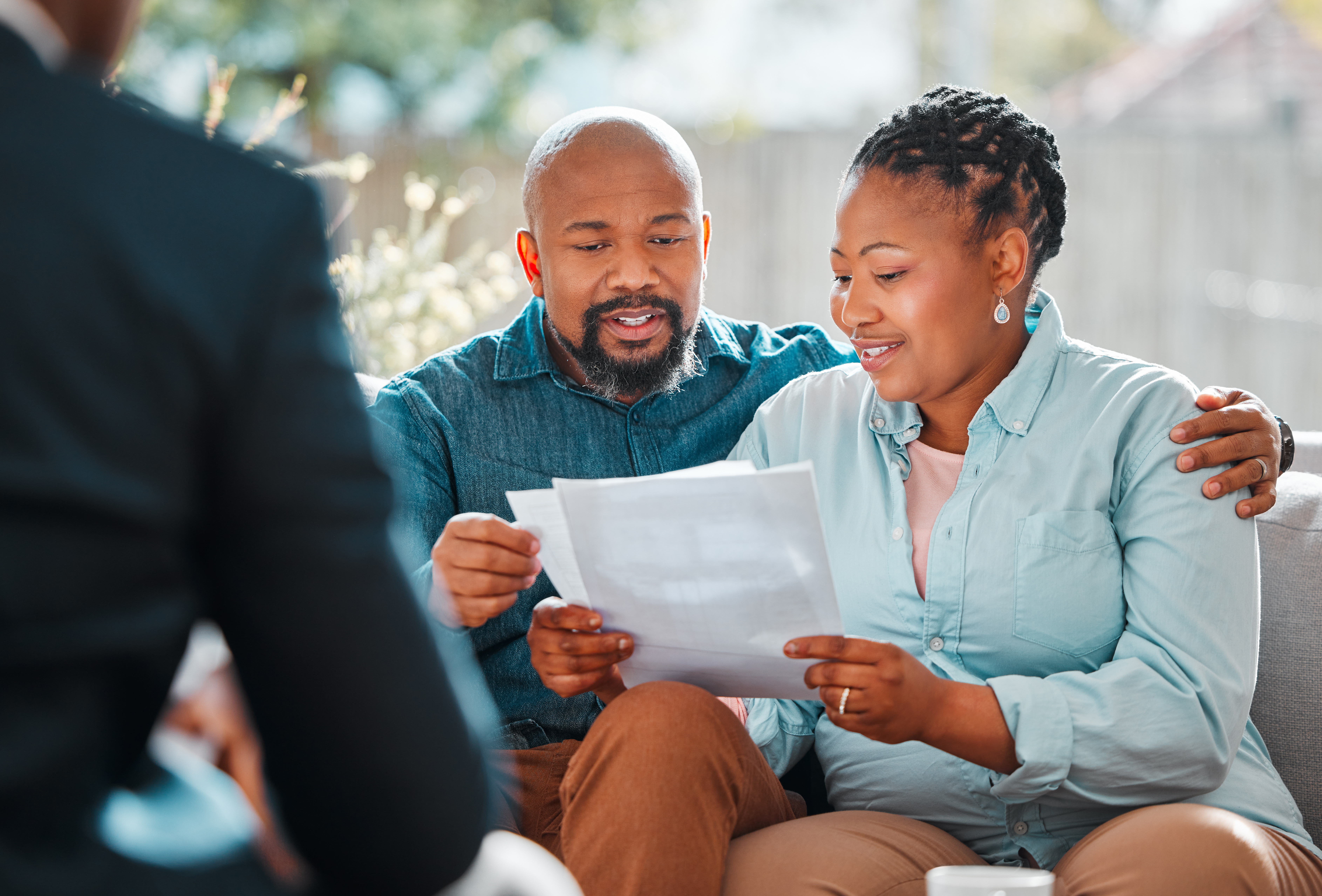 Couple meet with insurance advisor